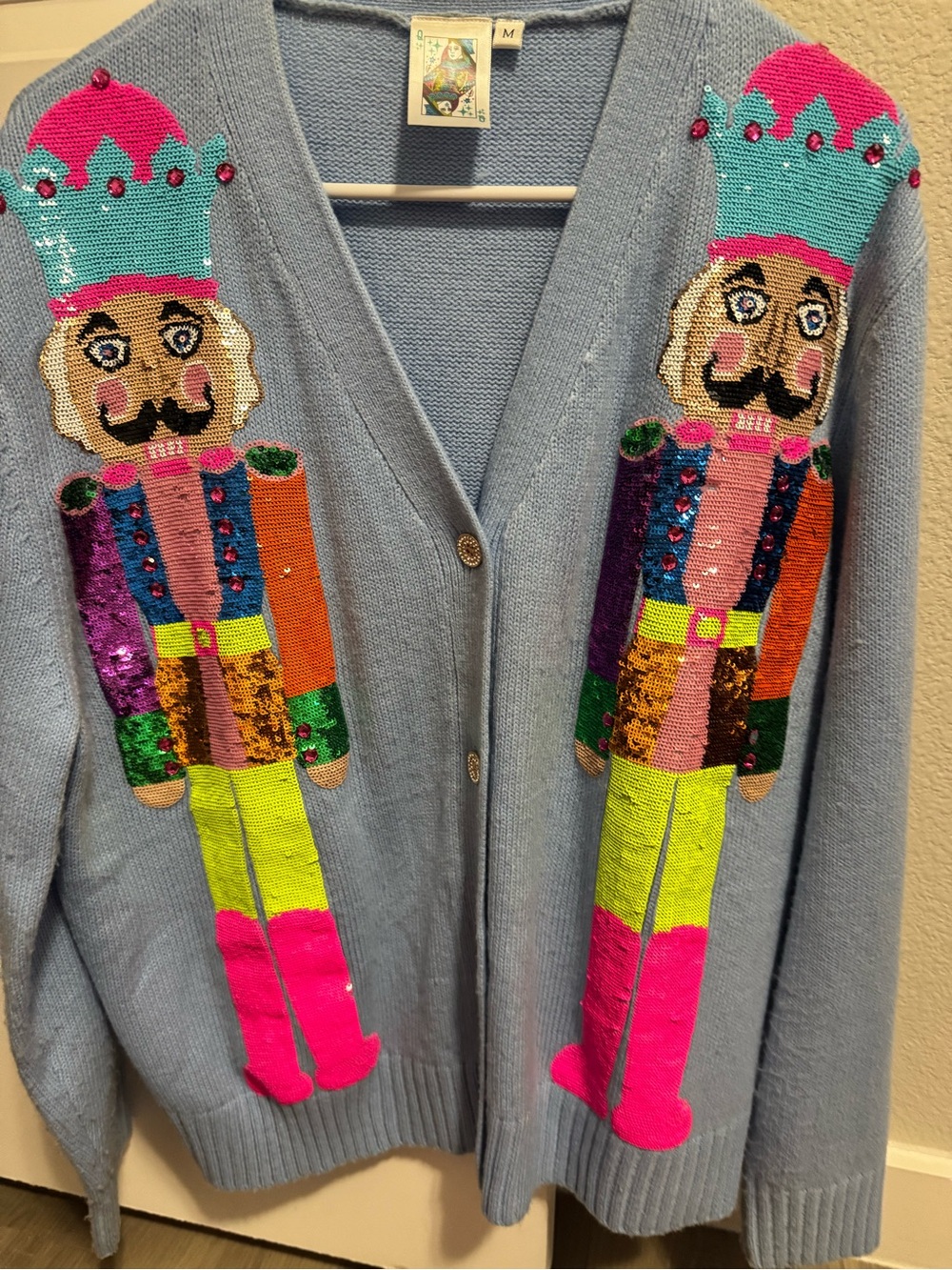 Light Blue Cardigan Sweater with Colorful Nutcracker Sequin Design - Picture 2 of 9